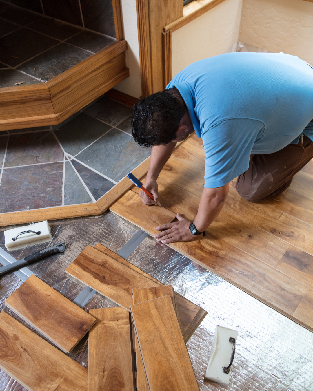Artist Flooring crew taking precise floor measurements before installation